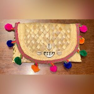 Twine & Twig Vibrant Woven Clutch with Multicolor Pom Pom’s And Cowrie shells